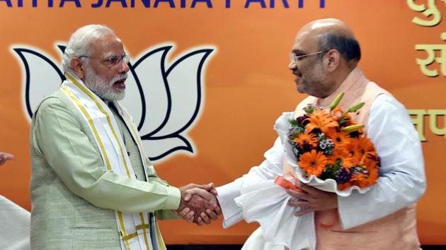 Prime Minister Narendra Modi and BJP president Amit Shah at the party headquarters to celebrate the party’s victory in UP and Uttrakhand assembly elections, in New Delhi on March 12, 2017. (PTI) Prime Minister Narendra Modi and BJP president Amit Shah at the party headquarters to celebrate the party’s victory in UP and Uttrakhand assembly elections, in New Delhi on March 12, 2017. (PTI)