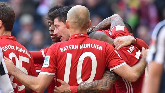 Robert Lewandowski scored twice as Bayern Munich opened up a 10-point lead in the Bundesliga after RB Leipzig and Borussia Dortmund suffered defeats.(AFP)