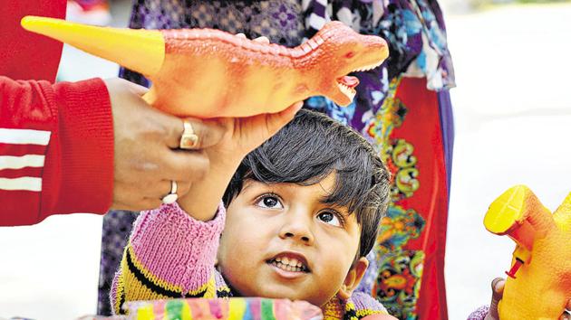 A child looks at a water gun for Holi at Indra Market. Many markets in Noida were buzzing with shoppers of all ages a day before Holi. (Sunil Ghosh/HT Photo) A child looks at a water gun for Holi at Indra Market. Many markets in Noida were buzzing with shoppers of all ages a day before Holi. (Sunil Ghosh/HT Photo)