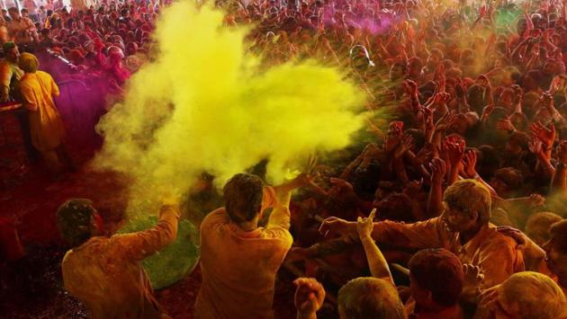 Devotees playing with colours at historical Govind Dev Ji temple in Jaipur . The streets and lanes across most of India have turned into a large playground where people of all faiths throw colored powder and water at each other. (PTI) Devotees playing with colours at historical Govind Dev Ji temple in Jaipur . The streets and lanes across most of India have turned into a large playground where people of all faiths throw colored powder and water at each other. (PTI)