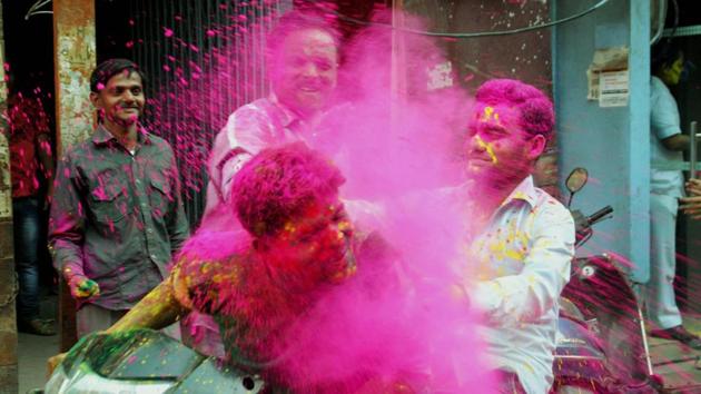 College students play with powdered colour as they take part in Holi festival celebrations in Lucknow . (Nand Kumar/ PTI) College students play with powdered colour as they take part in Holi festival celebrations in Lucknow . (Nand Kumar/ PTI)