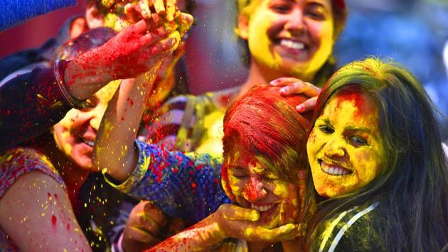 A college student reacts as coloured powder is thrown into her face during Holi in New Delhi. (Raj K Raj/HT PHOTO) A college student reacts as coloured powder is thrown into her face during Holi in New Delhi. (Raj K Raj/HT PHOTO)