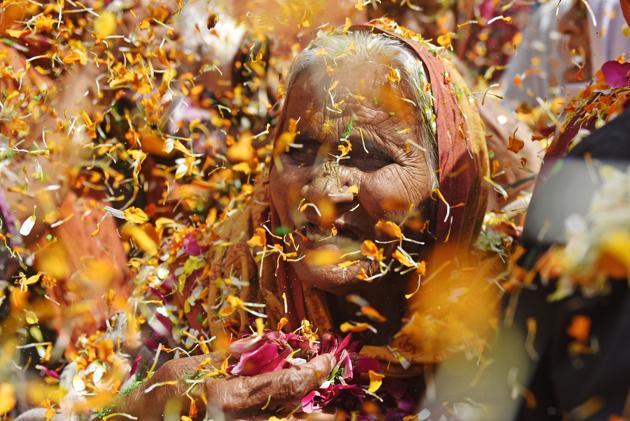 A widow participates in a celebration of the Holi festival at Gopinath temple,Vrindavan Thousands of Hindu widows, shunned and ignored by their own families, marked the Hindu spring festival of colours. (Pratik Chorge/HT Photo) A widow participates in a celebration of the Holi festival at Gopinath temple,Vrindavan Thousands of Hindu widows, shunned and ignored by their own families, marked the Hindu spring festival of colours. (Pratik Chorge/HT Photo)