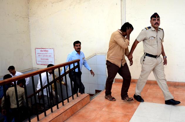 Policemen with the accused at the court on Saturday. (Bachchan Kumar) Policemen with the accused at the court on Saturday. (Bachchan Kumar)