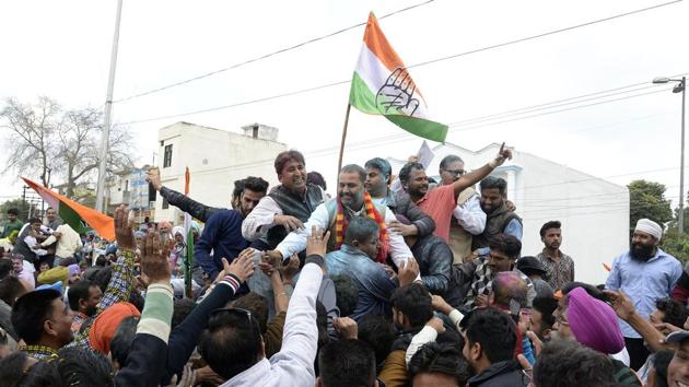 Indian Congress Party candidate for the Jalandhar West constituency Sushil Rinku (C) greets supporters after his win in Jalandhar on Saturday.(AFP Photo)