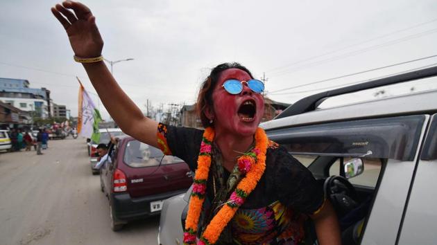 A supporter of National People’s Party (NPP) candidate, Y Joykumar, shouts as she celebrates his win in the Uripok constituency in Imphal. (Biju BORO/ AFP) A supporter of National People’s Party (NPP) candidate, Y Joykumar, shouts as she celebrates his win in the Uripok constituency in Imphal. (Biju BORO/ AFP)