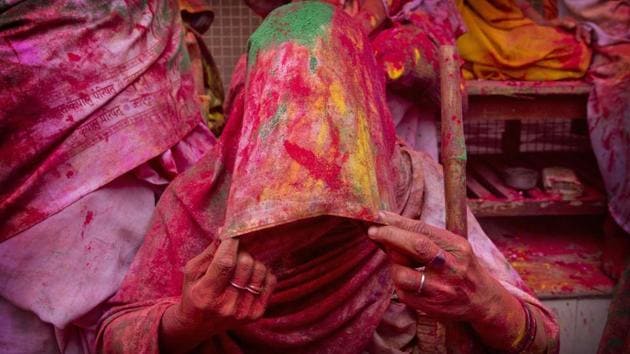 A widow smeared with colours covers her face during Holi celebrations, the arrival of spring festival, at the Gopinath temple in Vrindavan. (Manish Swarup / AP) A widow smeared with colours covers her face during Holi celebrations, the arrival of spring festival, at the Gopinath temple in Vrindavan. (Manish Swarup / AP)