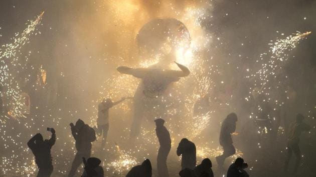 Two months after an explosion tore through the Tultepec fireworks market, killing 42, the town honoured its patron saint San Juan de Dios in its usual exuberant style, by exploding hundreds of colorful bulls elaborately rigged with fireworks in a field and the town square. (Rebecca Blackwell / AP) Two months after an explosion tore through the Tultepec fireworks market, killing 42, the town honoured its patron saint San Juan de Dios in its usual exuberant style, by exploding hundreds of colorful bulls elaborately rigged with fireworks in a field and the town square. (Rebecca Blackwell / AP)