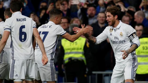 Real Madrid CF's Sergio Ramos (R) celebrates with teammate Lucas Vazquez after scoring against Real Betis in La Liga.(REUTERS)