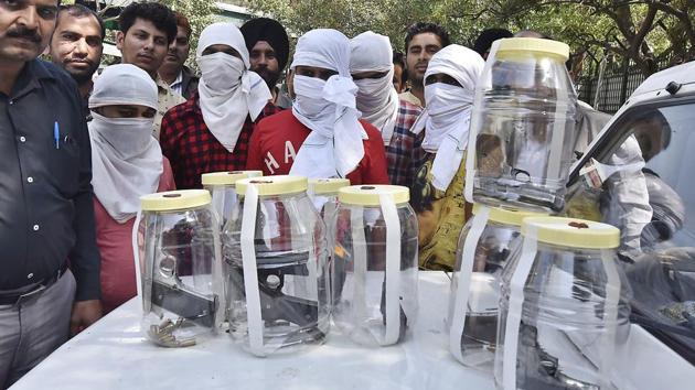 Delhi Police special cell arrested five criminals involved in the murder of gangster Manjeet Mahal's father. Seven weapons and ammunition were recovered from them. The suspects were brought to police headquarters in New Delhi on March 12, 2017.(Raj K Raj/HT Photo)