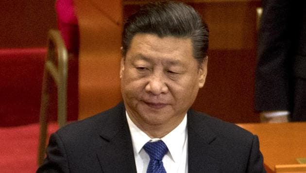 Chinese President Xi Jinping adjusts his suit jacket as he prepares to leave after the closing session of the Chinese People's Political Consultative Conference (CPPCC) at Beijing's Great Hall of the People on Monday. (AP) Chinese President Xi Jinping adjusts his suit jacket as he prepares to leave after the closing session of the Chinese People's Political Consultative Conference (CPPCC) at Beijing's Great Hall of the People on Monday. (AP)