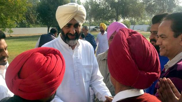 Newly-elected MLA and senior Congress leader Manpreet Singh Badal meeting party workers at Badal village in Bathinda on Sunday.(Sanjeev Kumar/HT)