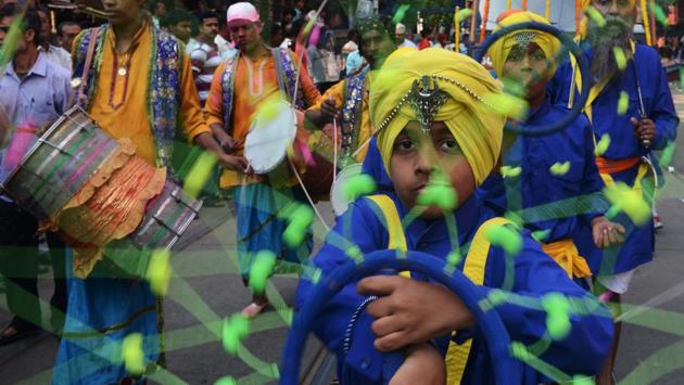 Young  sikhs performs 'Gatka', an ancient form of Sikh martial art during a procession through the streets of Anandpur Sahib. (AFP) 