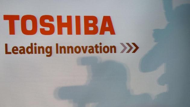 A Toshiba logo is seen during a press conference at their headquarters in Tokyo. Scandal-hit conglomerate Toshiba has delayed the release of its earnings results again, as it said it needed more time to investigate a possible accounting fraud at its loss-hit US nuclear unit.(AFP)