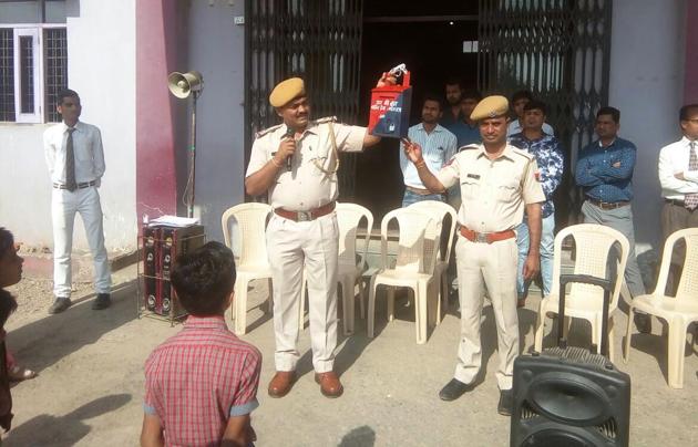 Police officials display the 'Mann Ki Baat’ boxes at a school in Pratapgarh. (HT photo) Police officials display the 'Mann Ki Baat’ boxes at a school in Pratapgarh. (HT photo)