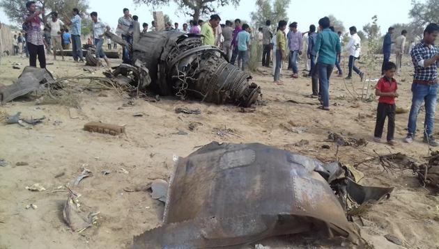 People gather at the crash site of the Sukhoi 30 aircraft in Rajasthan’s Barmer district on Wednesday. (HT Photo) People gather at the crash site of the Sukhoi 30 aircraft in Rajasthan’s Barmer district on Wednesday. (HT Photo)