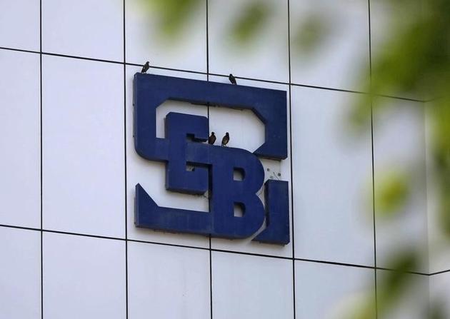 Birds rest on the logo of the Securities and Exchange Board of India (SEBI), India's market regulator, installed on the facade of its head office building in Mumbai Birds rest on the logo of the Securities and Exchange Board of India (SEBI), India's market regulator, installed on the facade of its head office building in Mumbai