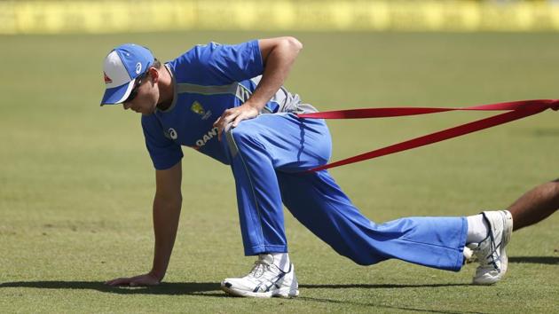 Australia cricket team's Josh Hazlewood stretches during a training session ahead of their third Test against India cricket team in Ranchi on Wednesday. (AP) Australia cricket team's Josh Hazlewood stretches during a training session ahead of their third Test against India cricket team in Ranchi on Wednesday. (AP)