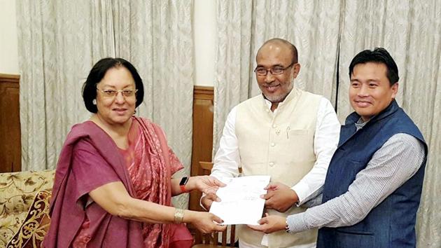 Manipur Governor Najma Heptulla handing over the invitation letter to BJP leader Nongthombam Biren Singh to form the government of Manipur at Raj Bhavan, Imphal , Manipur on Tuesday. (PTI Photo) Manipur Governor Najma Heptulla handing over the invitation letter to BJP leader Nongthombam Biren Singh to form the government of Manipur at Raj Bhavan, Imphal , Manipur on Tuesday. (PTI Photo)