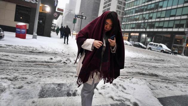 A woman walks on a snow and sleet covered street in New York. Winter Storm Stella unleashed its fury on much of the northeastern United States on March 14 dropping snow and sleet across the region and leading to school closures and thousands of flight cancellations. Stella, the most powerful winter storm of the season, was forecast to dump up to two feet (60 centimetres) of snow in New York and whip the area with combined with winds of up to 60 miles per hour (95 kilometers per hour), causing treacherous whiteout conditions. But after daybreak the National Weather Service (NWS) revised down its predicted snow accumulation for the city of New York, saying that the storm had moved across the coast. (Jewel Samad/AFP)