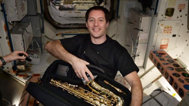 This image posted by French astronaut Thomas Pesquet on Twitter on March 12, 2017, shows him with a saxophone he received for his birthday aboard the International Space Station.(AP Photo)