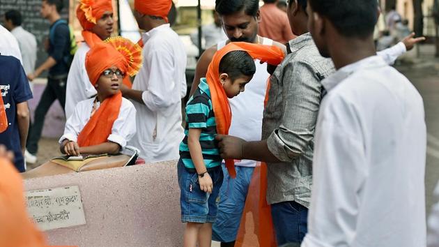 STARTING YOUNG: A child gets ready for a procession on the occasion of Shiv Jayanti at Ghatkopar. (Arijit Sen/HT Photo)