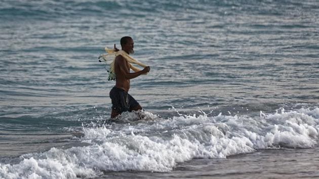 A fisherman walks out of the Indian Ocean with a net, at dusk in the former pirate village of Eyl. The United Nations warned in October that the situation was fragile and that Somali pirates “possess the intent and capability to resume attacks.” (Ben Curtis/AP) A fisherman walks out of the Indian Ocean with a net, at dusk in the former pirate village of Eyl. The United Nations warned in October that the situation was fragile and that Somali pirates “possess the intent and capability to resume attacks.” (Ben Curtis/AP)