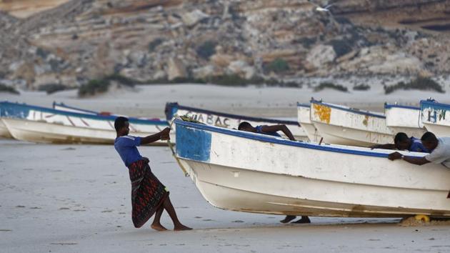 Fishermen pull their boats into the Indian Ocean shortly after dawn in the former pirate village of Eyl. Illegal fishing needs addressing, said John Steed, the director of Oceans Beyond Piracy. It’s an aggressive business and in some cases international fleets pressure, even attack, local fisherman, which breeds resentment, he wrote in an email. (Ben Curtis/AP) Fishermen pull their boats into the Indian Ocean shortly after dawn in the former pirate village of Eyl. Illegal fishing needs addressing, said John Steed, the director of Oceans Beyond Piracy. It’s an aggressive business and in some cases international fleets pressure, even attack, local fisherman, which breeds resentment, he wrote in an email. (Ben Curtis/AP)
