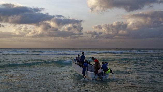 Fishermen set out for their day's work in the Indian Ocean shortly after dawn in the former pirate village of Eyl. Fishermen have reported several cases of attacks by illegal fishermen, including close-ramming of their boats by trawlers. They also reported incidents of foreign fishermen opening fire at them or robbing them of their catches before being chased away. (Ben Curtis/AP) Fishermen set out for their day's work in the Indian Ocean shortly after dawn in the former pirate village of Eyl. Fishermen have reported several cases of attacks by illegal fishermen, including close-ramming of their boats by trawlers. They also reported incidents of foreign fishermen opening fire at them or robbing them of their catches before being chased away. (Ben Curtis/AP)