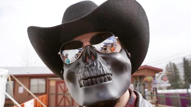 A man poses in a skeleton mask during the festival in Nederland. A man poses in a skeleton mask during the festival in Nederland.