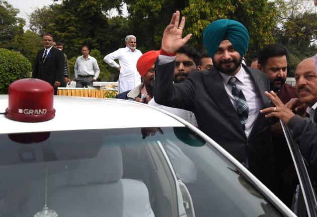Navjot Singh Sidhu with a red-beacon car after taking oath as a minister in the Punjab government led by Capt Amarinder Singh at Raj Bhawan in Chandigarh on Thursday. (Sanjeev Sharma/HT) 