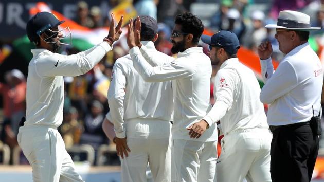 Cheteshwar Pujara and Ravindra Jadeja of India celebrates the wicket of David Warner of Australia. (BCCI)