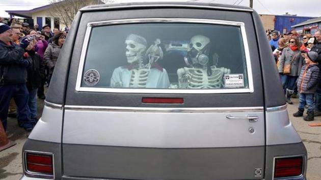 Mock skeletons are pictured in the back of a hearse during the hearse parade. Mock skeletons are pictured in the back of a hearse during the hearse parade.