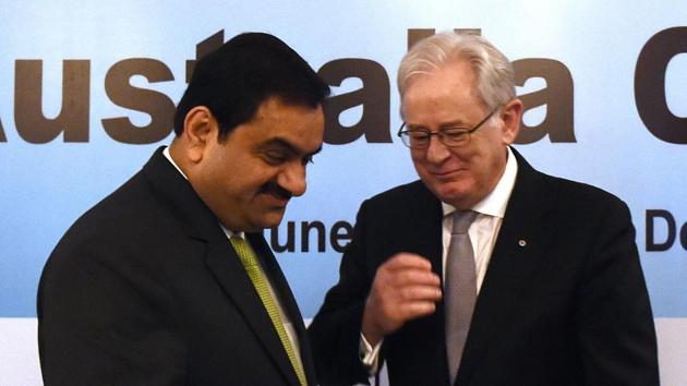 Photo taken on June 23, 2015 shows chairman and founder of India's Adani Group, Gautam Adani (L) speaking with then Australia's Trade and Investment Minister Andrew Robb during the Australia India CEO Forum in New Delhi.(AFP)