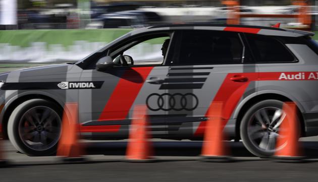 An autonomous car controlled by a Nvidia DRIVE PX 2 AI car computing platform drives passengers along a course during CES International.(AP)