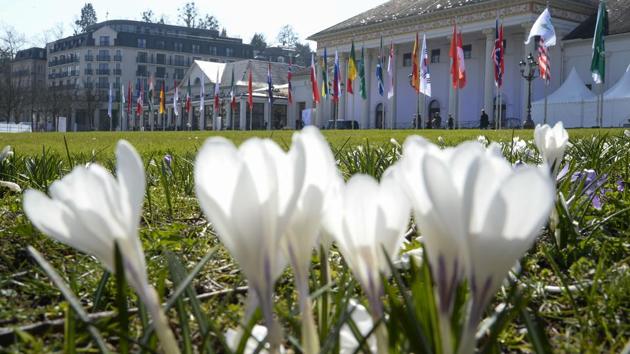 Crocuses bloom in front of the Kurhaus one day before the gathering of the G20 finance ministers and central bankers in Baden-Baden. (THOMAS KIENZLE / AFP)