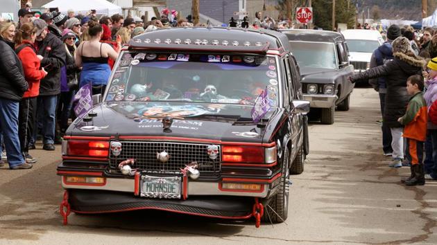 The festival runs for three days, attracts more than 20,000 people a year dressed in skeleton makeup and Halloween costumes, and features musical performances, a frozen salmon toss, a very literal parade of hearses, and a coffin race where teams carry their ‘dead’ friends to a finish line in a coffin. (Rick Wilking / REUTERS) The festival runs for three days, attracts more than 20,000 people a year dressed in skeleton makeup and Halloween costumes, and features musical performances, a frozen salmon toss, a very literal parade of hearses, and a coffin race where teams carry their ‘dead’ friends to a finish line in a coffin. (Rick Wilking / REUTERS)