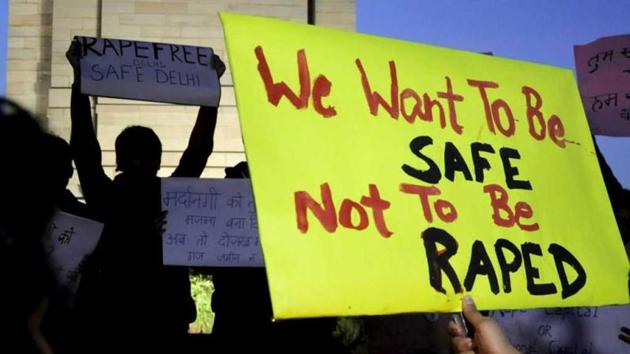 People hold up anti-rape placards during a recent protest rally at India Gate in New Delhi.(Saarthak Aurora/ HT Photo)