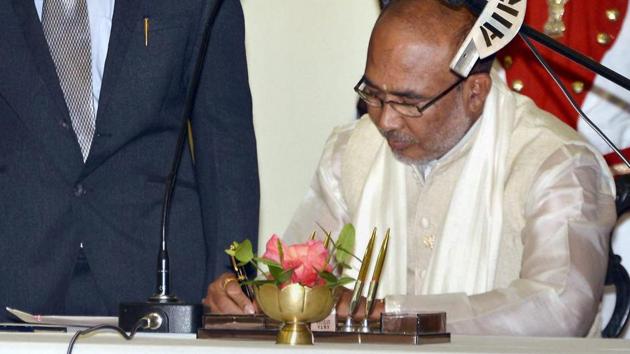 N Biren Singh after taking the oath of office during his swearing-in ceremony in Imphal.(PTI Photo)