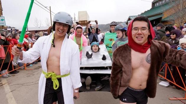 A coffin race team parades down the street in the annual ‘Frozen Dead Guy Days’ festival inspired by a frozen corpse. A coffin race team parades down the street in the annual ‘Frozen Dead Guy Days’ festival inspired by a frozen corpse.