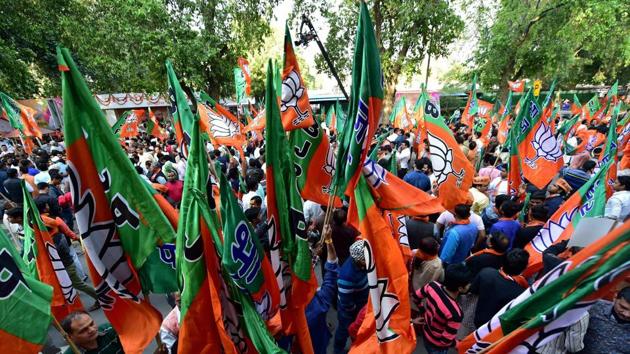 BJP supporters at the party headquarters to celebrate victory in UP and Uttrakhand assembly elections, in New Delhi on Sunday. (PTI) BJP supporters at the party headquarters to celebrate victory in UP and Uttrakhand assembly elections, in New Delhi on Sunday. (PTI)