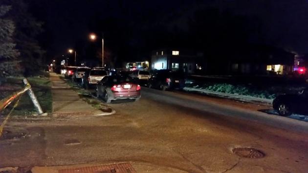 Authorities investigate the scene after a police officer was shot Wednesday, March 15, 2017, in Columbus, Ohio. The Columbus Dispatch reports officers were executing a search warrant at an apartment house at the time.(AP Photo)