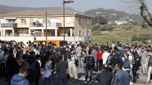 High school students gather near the Tocqueville high school in Grasse in France after a shooting incident. (REUTERS) High school students gather near the Tocqueville high school in Grasse in France after a shooting incident. (REUTERS)
