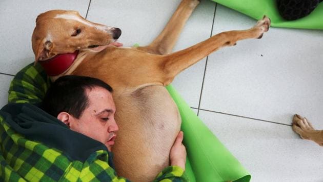 Andres Garcia, 29, embraces Argi, as he relaxes at Benito Menni health facility in Elizondo, northern Spain. Puppy love is part of the treatment for conditions such as schizophrenia. (Susana Vera/REUTERS) Andres Garcia, 29, embraces Argi, as he relaxes at Benito Menni health facility in Elizondo, northern Spain. Puppy love is part of the treatment for conditions such as schizophrenia. (Susana Vera/REUTERS)