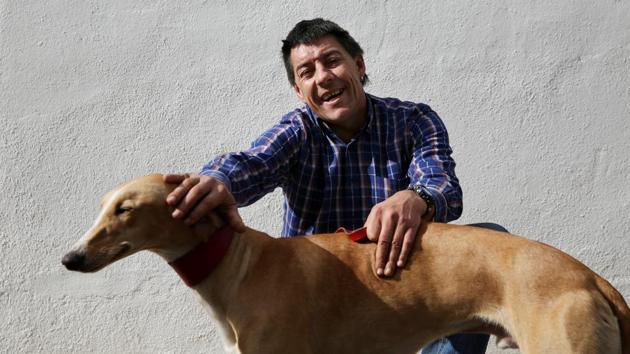44-year-old David Villanueva poses with Argi. Alongside misty views of green rolling mountains, petting sessions with the eight-month-old puppies have a calming effect serving as an emotional outlet for patients who struggle to connect with others. (Susana Vera/REUTERS) 44-year-old David Villanueva poses with Argi. Alongside misty views of green rolling mountains, petting sessions with the eight-month-old puppies have a calming effect serving as an emotional outlet for patients who struggle to connect with others. (Susana Vera/REUTERS)