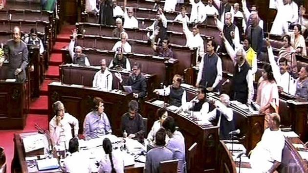 Opposition party members protest in the Rajya Sabha in New Delhi. (PTI) Opposition party members protest in the Rajya Sabha in New Delhi. (PTI)