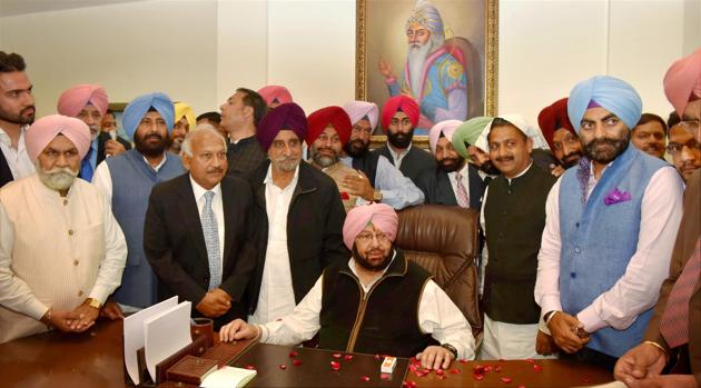 Captain Amarinder Singh assuming the charge of office in Chandigarh on Thursday. (PTI) Captain Amarinder Singh assuming the charge of office in Chandigarh on Thursday. (PTI)
