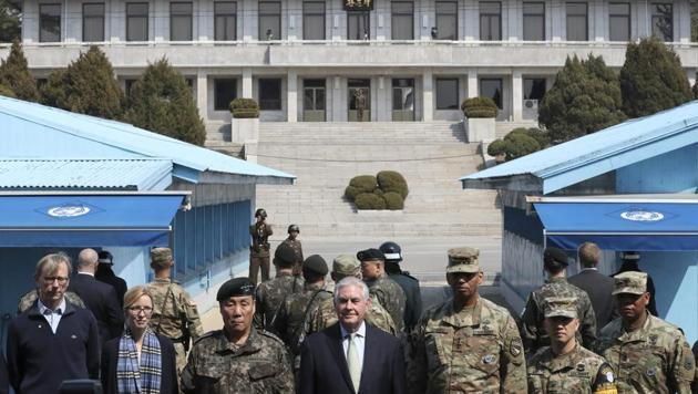 US secretary of state Rex Tillerson (C) stands with US Gen. Vincent K. Brooks (3rdR), commander of the United Nations Command, Combined Forces Command and United States Forces Korea and deputy Commander of the Combined Force Command General Leem Ho-young (3rdL), as North Korean soldiers look at the south side in the border village of Panmunjom, which has separated the two Koreas since the Korean War, South Korea. (Reuters Photo) US secretary of state Rex Tillerson (C) stands with US Gen. Vincent K. Brooks (3rdR), commander of the United Nations Command, Combined Forces Command and United States Forces Korea and deputy Commander of the Combined Force Command General Leem Ho-young (3rdL), as North Korean soldiers look at the south side in the border village of Panmunjom, which has separated the two Koreas since the Korean War, South Korea. (Reuters Photo)