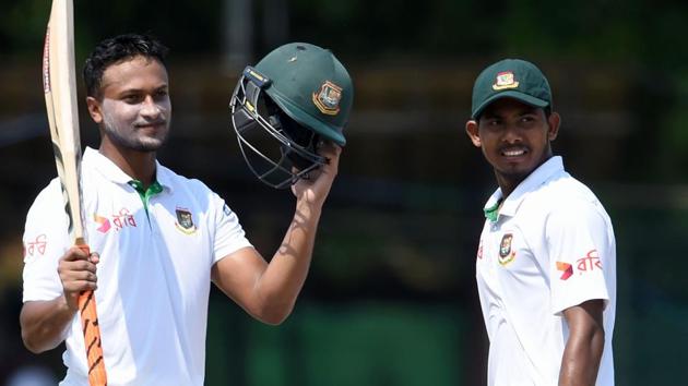 Shakib Al Hasan (left) celebrates his century as teammate Mosaddek Hossain watches on third day of the second and final Test between Sri Lanka and Bangladesh at The P. Sara Oval Cricket Stadium in Colombo on Friday. Catch live cricket score of Sri Lanka vs Bangladesh here.(AFP)