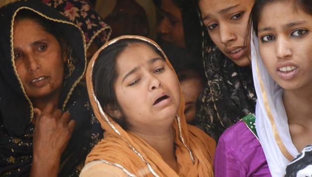 The boy’s relatives at their home in Chaman Vihar, behind the new bus stand in Ghaziabad. (Sakib Ali /HT Photo)